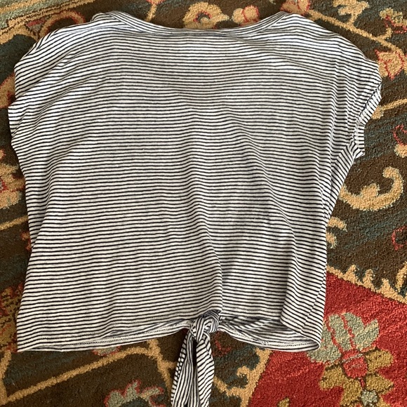 Navy blue and white stripped T-shirt, buttons down the middle, tie at bottom. - Picture 2 of 3